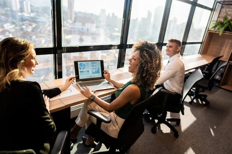 Mother and children walking on beach, representing work-life balance and family priorities
